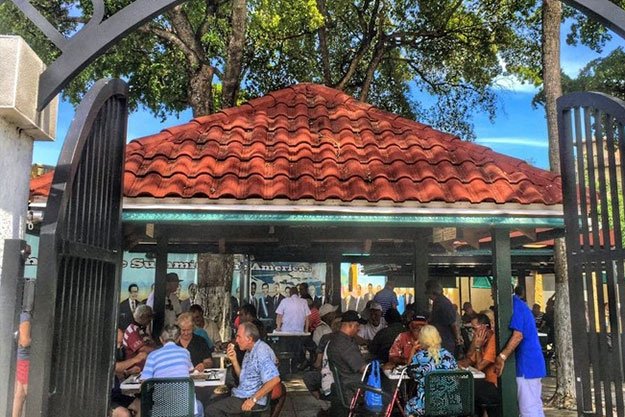 The sounds of dominoes shuffling fill the air in Miami's Domino Park in the Little Havana Neighborhood